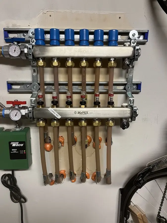 Plumber performing Water Heater Repair at a residential property in Richland